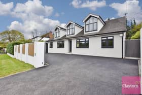 This contemporary style detached home includes ample off-street gated parking.