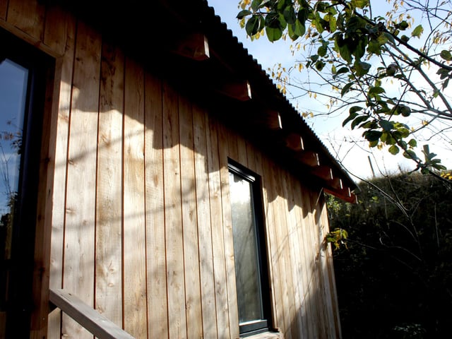 The cabin is lovingly clad with local larch and Douglas fir.