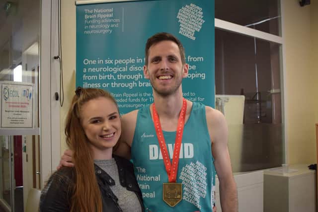 David Maloney, who survived a serious brain injury, is supported by proud girlfriend Jade