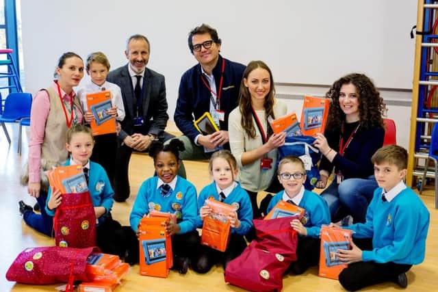 Lorenzo Barbo of Amazon Hemel Hempstad with executive principal Neil Jones, colleagues and pupils