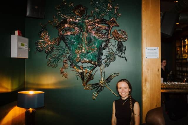 Lois Cordelia sculptor of Green Man made with straws at The Akeman