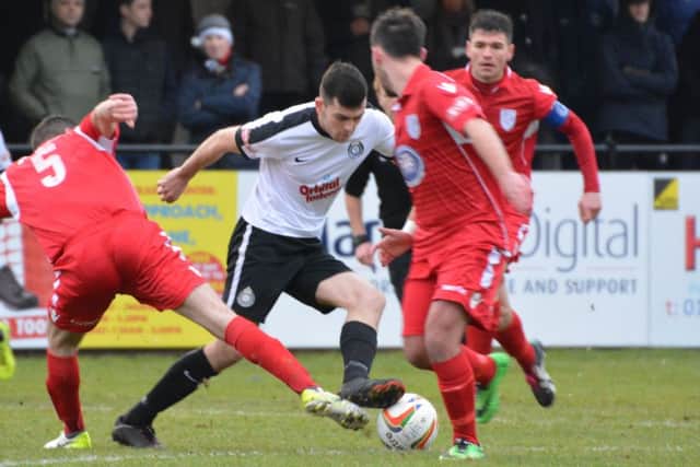 Mitchell Weiss battles for the ball against Merthyr. (Picture: Chris Riddell)