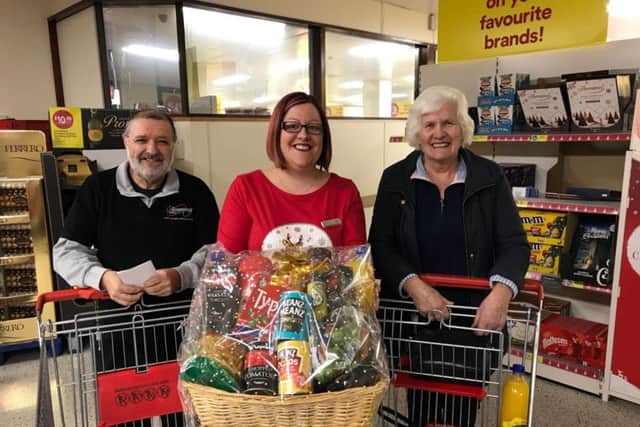 Slimming World consultant Haylea Gavin with the winner and runner-up of the Free Food Supermarket Sweep