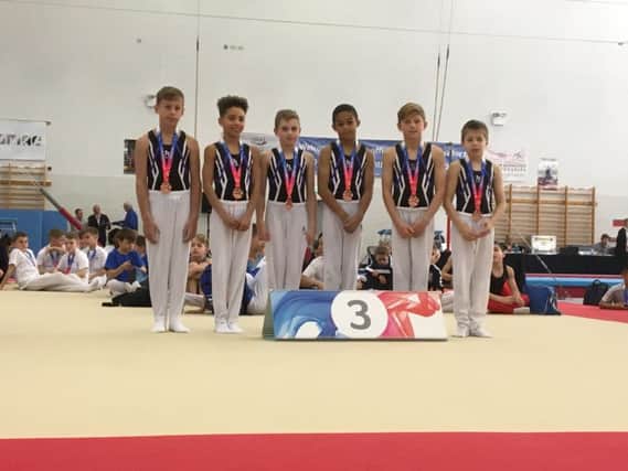 Sapphire pair Theo Potton, third from left, and Tobias Achampong, fourth from left, were part of the East Region team that won a bronze medal in the Elite Level 2 division at the national finals in Birmingham.