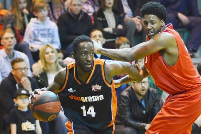 Hemel Storms Wayne Yeboah driving past Rockets American centre Tim Gill. (Picture: Lin Titmuss)