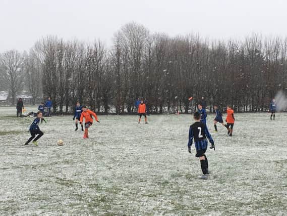 Raiders (in blue and black) playing at Chesham Athletic in the snow.