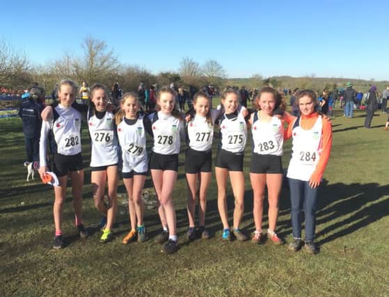 Charlotte Hilton (279) and Olivia Edwards (278) with the gold-medal winning Dr Challoners High junior girls team.