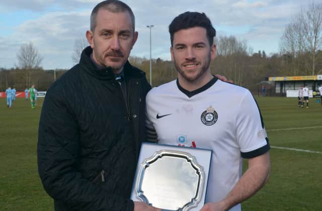 Kings Langley chairman Jeremy Wilkins presents Gary Connolly with an engraved plate to commemorate the defender's 200th appearance at the Slough match. (Picture by Chris Riddell)