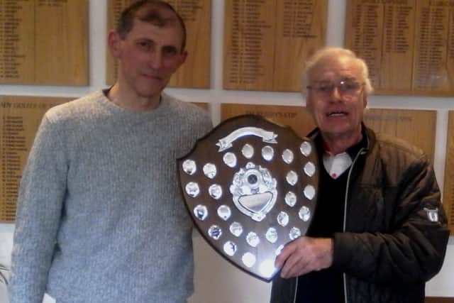 Little Hay GC club captain Trevor Sargent presenting Brian Ridgeway with the Alan Irwin Shield.