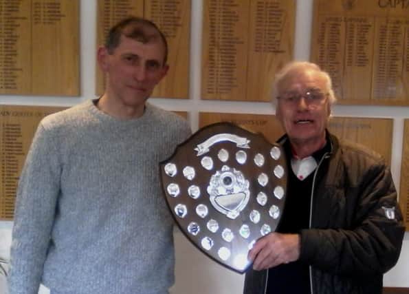 Little Hay GC club captain Trevor Sargent presenting Brian Ridgeway with the Alan Irwin Shield.