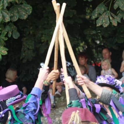 Wicket Brood members with their ash sticks