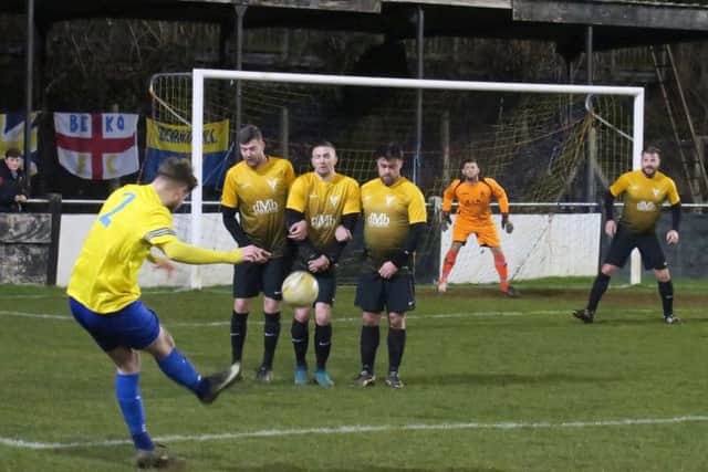 Berkos Adam Mead curls in a free-kick  against Markyate in the Comrades midweek 7-1 cup victory.