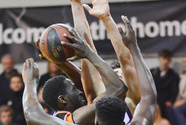 Hemel Storms Wayne Yeboah amidst a sea of hands against Loughborough on Saturday. (Picture by Lin Titmuss).