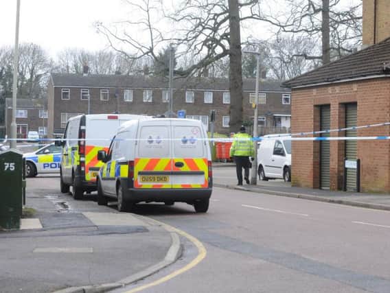 Police pictured at the scene of the stabbing on Saturn Way