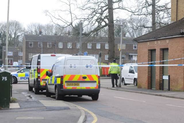 Police pictured at the scene of the stabbing on Saturn Way