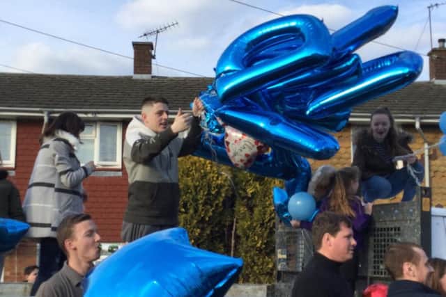 Balloons are released to celebrate the birthday of David Molloy, who sadly died last week