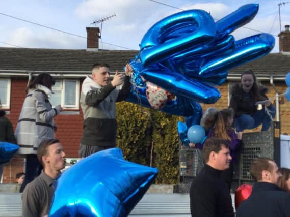 Balloons are released to celebrate the birthday of David Molloy, who sadly died last week