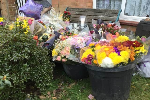 Floral tribute outside the family home has grown nearly a week after David was tragically stabbed