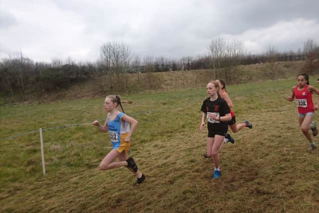 Brooke Evans, in the black Hertfordshire shirt, at the National Cross-Country Championships at the weekend.