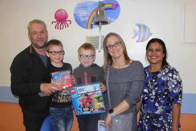 Jenson, centre, with mum Nicky, dad David, brother Cayden and consultant Dr Vasanta Nanduri