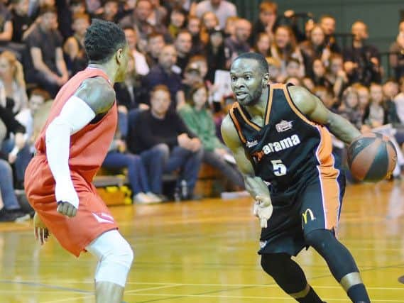 Storm skipper Bode Adeluola puts a Reading defender on the back foot. (Pictures by Lin Titmuss)