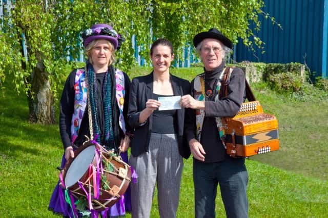 The cheque is presented to Amy Bottali of Rennie Grove Hospice Care