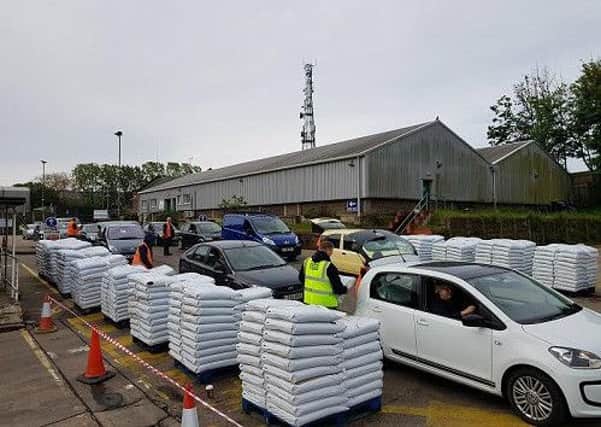 Cars queue for compost at Cupid Green Recycling Centre
