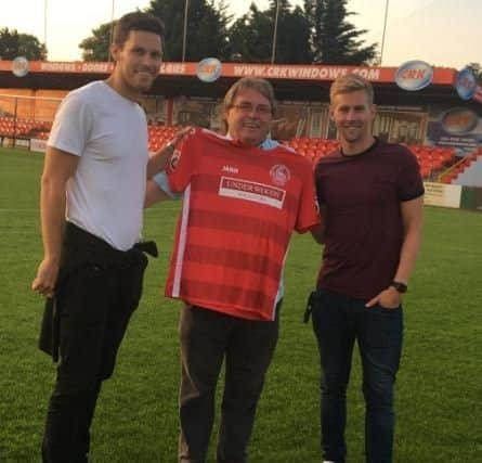 Striker Charlie Sheringham, Tudors' chairman Dave Boggins and club captain Jordan Parkes.