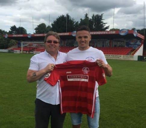 Tudors chairman Dave Boggins with Kyle Connolly after the clubs longest-serving player put pen to paper on a new deal to stay at Vauxhall Road.