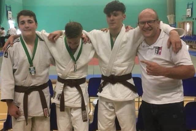 Rhys Connor, Gergo Berendi and Charlie Bennett with coach Laurie Rush.