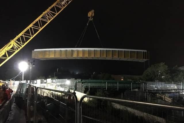 The bridge is craned into place