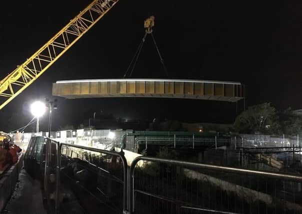 The bridge is craned into place