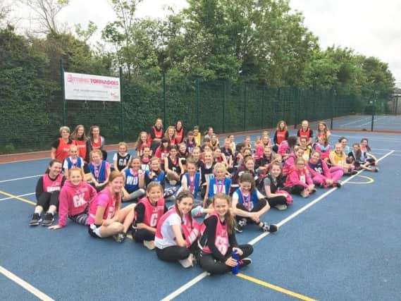 Tring Tornadoes youngsters at their charity netball tournament in May which raised more than Â£800 for the Camfed charity.