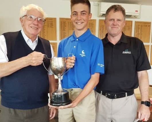 From left, Little Hays president Ralph Lane, Junior Club Champion Harry Miller and junior  organiser Patrick Ashton.
