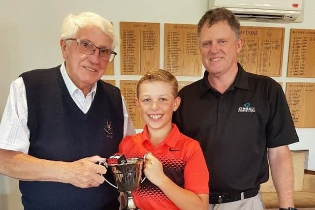 From left, Little Hay president Ralph Lane, Junior Cup winner Thomas Ashton and junior organiser Patrick Ashton.