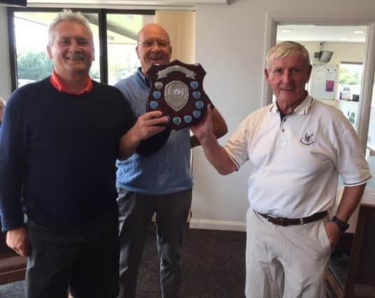 From left, David Smith, Little Hay GCs senior captain Paul Whiter and Sylvester Nolan with the Frank Spence Memorial Shield.