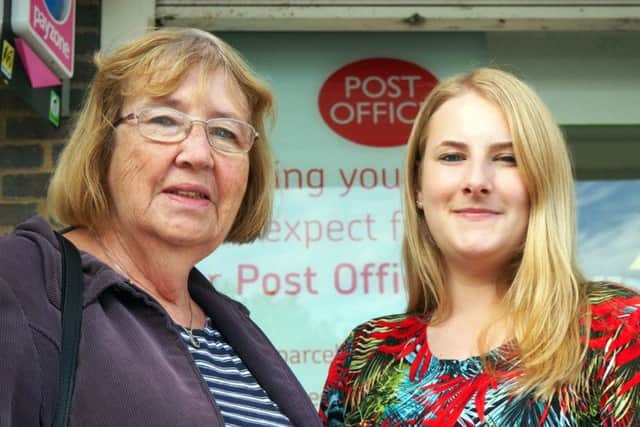 Cllr Brenda Link (left), outside Bellgate Post Office