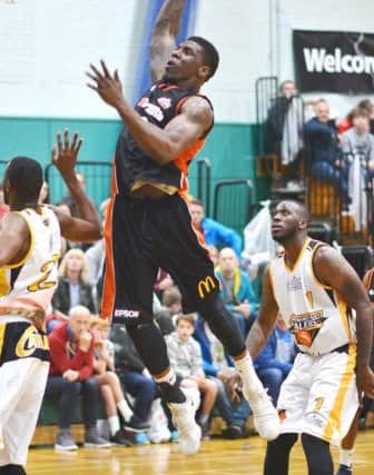 Leome Francis finishes with a thunderous dunk. (Photo: by Lin Titmuss)