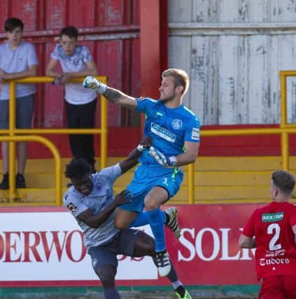 Hemel Towns in-form keeper Laurie Walker punches clear against Oxford City on Saturday in the Tudors 2-1 victory. (Picture by Marc Keinch).