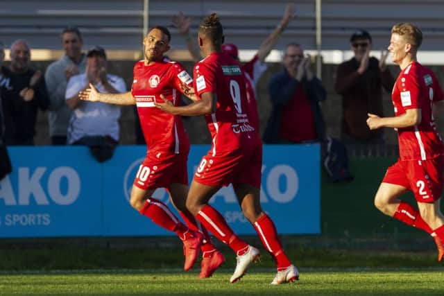 Hemel Town front-man Phil Roberts, left, celebrates after netting the Tudors goal on Saturday against Oxford City in the FA Cup, the striker's fifth goal of the season in all competiions. (Picture: By Marc Keinch).