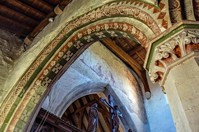 Painted arch, wall painting and rood screen at St Leonards, Flamstead