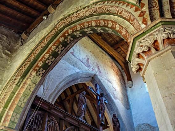 Painted arch, wall painting and rood screen at St Leonards, Flamstead