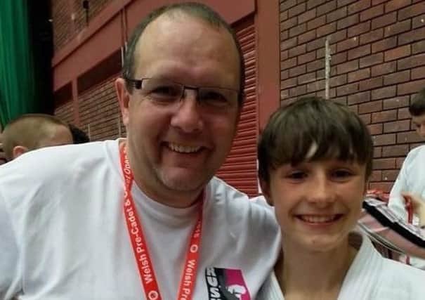 Rush Judo's Lewis Fryer with coach Pete Brent.