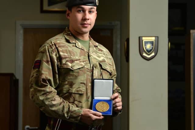 Corporal Skinner with his Top Instructor award