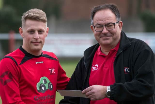 Tring Athletics recent arrival Jon Clements, left, receiving the clubs player of the month award for February from club secretary Bob Winter before Athletics impressive 4-1 triumph over Stotfold on Saturday.