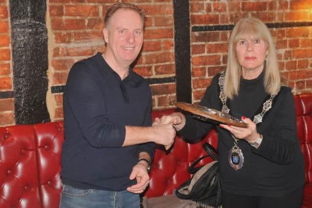 Chairman of Berkhamsted Cycling Club, Mike Plowman, is presented with the Harp Hilly 100 Shield by the mayor of Berkhamsted, Councillor Sue Beardshaw.