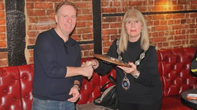 Chairman of Berkhamsted Cycling Club, Mike Plowman, is presented with the Harp Hilly 100 Shield by the mayor of Berkhamsted, Councillor Sue Beardshaw.