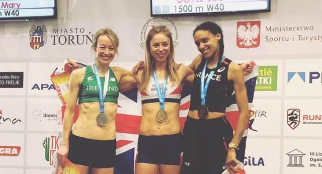 Zoe Doyle, centre, on the 1500m podium at the World Masters indoor championships in Poland.