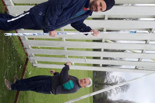 Hemel Hempstead Town club stalwarts Dave Jenkins, left, and Jim Langley helping to spruce up the sightscreens at Heath Park ahead of the new season.