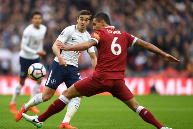 LONDON, ENGLAND - OCTOBER 22: Dejan Lovren of Liverpool attempts to stop a pass from Harry Winks of Tottenham Hotspur during the Premier League match between Tottenham Hotspur and Liverpool at Wembley Stadium on October 22, 2017 in London, England.  (Photo by Shaun Botterill/Getty Images) PNL-190528-114233002